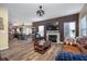 Open concept living room with kitchen views and hardwood floors at 7541 Mather Ln, Indianapolis, IN 46239