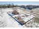 Aerial view of a neighborhood playground with swings and slides, partially covered in snow at 7541 Mather Ln, Indianapolis, IN 46239