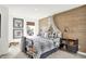 Charming bedroom with wood-paneled wall and plaid bedding at 8857 Lowell St, McCordsville, IN 46055