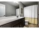 Bathroom with double vanity, shower/tub combo and yellow accents at 892 Ascot Farm Way, Westfield, IN 46074