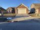 Front view of a brick ranch home with a driveway and landscaping at 952 Rentham Ln, Indianapolis, IN 46217