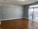 Spacious living room with hardwood floors and sliding glass doors at 952 Rentham Ln, Indianapolis, IN 46217