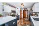 Modern kitchen with stainless steel appliances and white and blue cabinets at 974 Foxtail Ct, Franklin, IN 46131