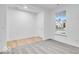 Bright bedroom featuring a window and a combination of hardwood and carpeted flooring at 1020 Stonehaven Dr, Indianapolis, IN 46239