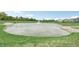 Serene community pond featuring a water fountain and lush green landscaping at 1020 Stonehaven Dr, Indianapolis, IN 46239