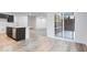 Bright kitchen featuring dark cabinets, stainless steel appliances, and light floors at 1020 Stonehaven Dr, Indianapolis, IN 46239