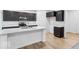 Modern kitchen featuring dark cabinets, stainless steel appliances, and a bright white island at 1020 Stonehaven Dr, Indianapolis, IN 46239