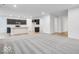 Open-concept living space with modern gray carpet and dark cabinets for a sleek and inviting atmosphere at 1020 Stonehaven Dr, Indianapolis, IN 46239