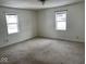 Bedroom with neutral carpet and two windows at 1097 S 5Th St, Noblesville, IN 46060