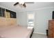 Main bedroom with king bed, wood headboard, and window view at 1181 Hospital Rd, Franklin, IN 46131