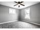 Cozy bedroom featuring neutral carpeting, gray walls and a ceiling fan at 1206 Comer Ave, Indianapolis, IN 46203