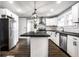 Open kitchen featuring stainless steel appliances, a center island, and white subway tile backsplash at 1206 Comer Ave, Indianapolis, IN 46203