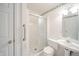 Clean bathroom with a shower/tub combo, pedestal sink, and linen closet at 1217 Charleston Commons Dr # 25, Anderson, IN 46012