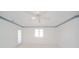 Bedroom with ceiling fan and window at 1217 Charleston Commons Dr # 25, Anderson, IN 46012