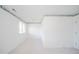 Empty bedroom with white walls, carpet, and a window at 1217 Charleston Commons Dr # 25, Anderson, IN 46012