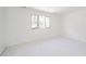 Empty bedroom with white walls, carpeting, and window at 1217 Charleston Commons Dr # 25, Anderson, IN 46012