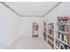 Bright bedroom with large bookshelves and window at 1217 Charleston Commons Dr # 25, Anderson, IN 46012