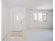 Empty entryway with white walls, door, and carpet at 1217 Charleston Commons Dr # 25, Anderson, IN 46012