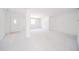 Spacious entryway with white door and carpet, leading into the home at 1217 Charleston Commons Dr # 25, Anderson, IN 46012