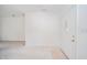 Empty entryway with white walls, door, and carpet at 1217 Charleston Commons Dr # 25, Anderson, IN 46012
