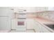 White kitchen features include a microwave, oven, and refrigerator at 1217 Charleston Commons Dr # 25, Anderson, IN 46012