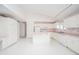 White kitchen with an island, cabinets, and appliances at 1217 Charleston Commons Dr # 25, Anderson, IN 46012