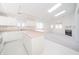 Open concept kitchen and living area with pink island and skylights at 1217 Charleston Commons Dr # 25, Anderson, IN 46012