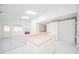 Open concept kitchen and living room with pink island and fireplace at 1217 Charleston Commons Dr # 25, Anderson, IN 46012