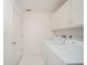 Bright laundry room featuring a washer, dryer and cabinets at 1217 Charleston Commons Dr # 25, Anderson, IN 46012