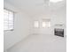 Living room with fireplace, ceiling fan, and patio door access at 1217 Charleston Commons Dr # 25, Anderson, IN 46012