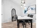 Elegant dining room featuring a modern table and a decorative mirror at 12584 Tennyson Ln # 208, Carmel, IN 46032