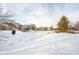 Winter view of condo pond, partially covered with snow and ice at 12584 Tennyson Ln # 208, Carmel, IN 46032