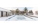 Community pool covered in snow and surrounded by fence at 12584 Tennyson Ln # 208, Carmel, IN 46032