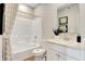 Modern bathroom with white vanity, shower/tub combo, and patterned curtain at 1500 Covington Blvd, Franklin, IN 46131