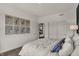 Bedroom with white bedding, blue accents, and botanical prints at 1552 Covington Blvd, Franklin, IN 46131