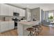 Modern kitchen with white cabinets, island, and stainless steel appliances at 1552 Covington Blvd, Franklin, IN 46131