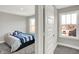 Neutral bedroom with natural light and doorway to another room at 16258 Perrault Ct, Fishers, IN 46040