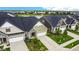 Luxury townhouses with attached garages, community lake, and lush landscaping at 17083 Cole Evans Dr, Noblesville, IN 46060