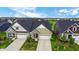 Community of new construction homes with attached garages and manicured lawns at 17083 Cole Evans Dr, Noblesville, IN 46060