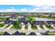 Aerial view of a beautiful community with homes and pond at 17083 Cole Evans Dr, Noblesville, IN 46060