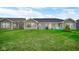 Spacious backyard with a patio and green lawn at 17083 Cole Evans Dr, Noblesville, IN 46060
