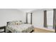 Bedroom with floral bedding and neutral decor at 17083 Cole Evans Dr, Noblesville, IN 46060