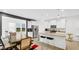 Modern kitchen with white cabinets, granite counters, and stainless steel appliances at 17083 Cole Evans Dr, Noblesville, IN 46060