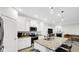 Open concept kitchen with island, granite countertops, and white cabinetry at 17083 Cole Evans Dr, Noblesville, IN 46060