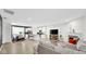 Open concept living space with modern fireplace and kitchen views at 17083 Cole Evans Dr, Noblesville, IN 46060