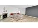 Spacious living room featuring a cozy fireplace and large sectional sofa at 17083 Cole Evans Dr, Noblesville, IN 46060