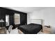 Bedroom with a double bed, desk, and black accent wall at 17935 Paula, Westfield, IN 46074