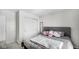 Simple bedroom with a queen-size bed and double doors to closet at 17935 Paula, Westfield, IN 46074