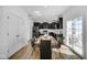 Modern kitchen with dark cabinetry, stainless steel appliances, and an island at 17935 Paula, Westfield, IN 46074