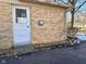 Brick exterior with a side door and small steps at 2147 W 65Th St, Indianapolis, IN 46260